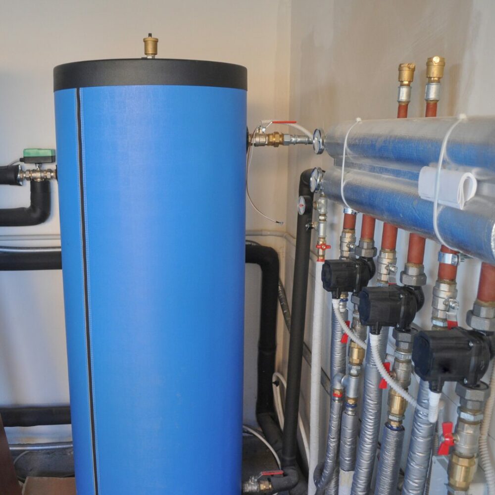 Plumber repairing a burst geyser